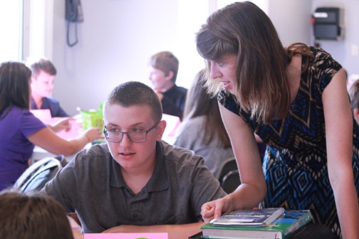The Math Mega Block is a multi-grade class that allows students to work in the area of math based on their skill development and not their grade level. Middle School Science and Math Mega Block Applications teacher Julie Eckels, right, assists eighth-grader Gabe Ceresini as he begins an assignment. SUBMITTED PHOTOS